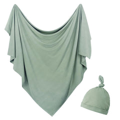 OWLOWLA newborn swaddle olive blanket flatlay shows soft jersey knit for gentle warmth.