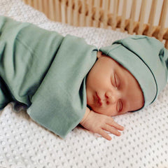 OWLOWLA newborn swaddle olive hat showcases soft knit warmth for comfy baby wear.