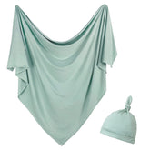 OWLOWLA Sage newborn swaddle blanket flat lay shows soft rayon-spandex fabric for gentle wrap