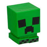 Paladone Minecraft Creeper SquishyGlo light turned on, showing vivid green glow for kid-friendly bedside lighting.