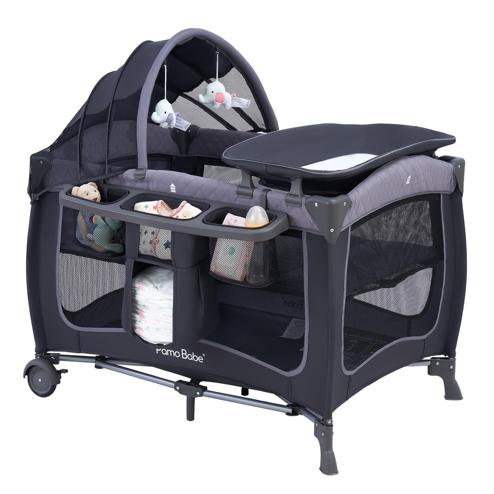 Pamo Babe canopy assembly view on the playard shows quick setup for new parents.