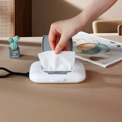 PandaEar compact wipes dispenser fits diaper bag for on-the-go changes.