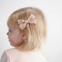 Panpinmama toddler-size bows 2.5 inches fit fine hair comfortably.