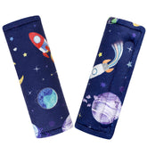 Pea Pod strap cover on car seat with outer space design for gentle skin protection.