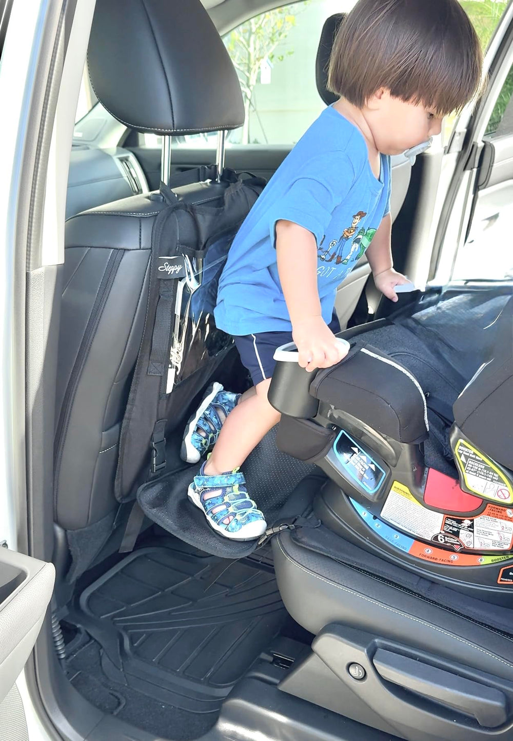 Peace of Mind Steppy side view showing car seat protector preventing spills