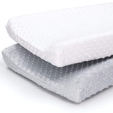 The Peanutshell changing pad cover in grey-white minky adds plush comfort during diaper changes.