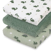 The Peanutshell dinosaur changing pad cover in sage green set keeps diaper changes tidy.
