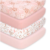 The Peanutshell floral crib sheet set in pink tones adds cohesive nursery decor.