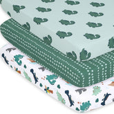 The Peanutshell green dinosaur playard sheet snugly fits a standard mattress for nap time comfort.