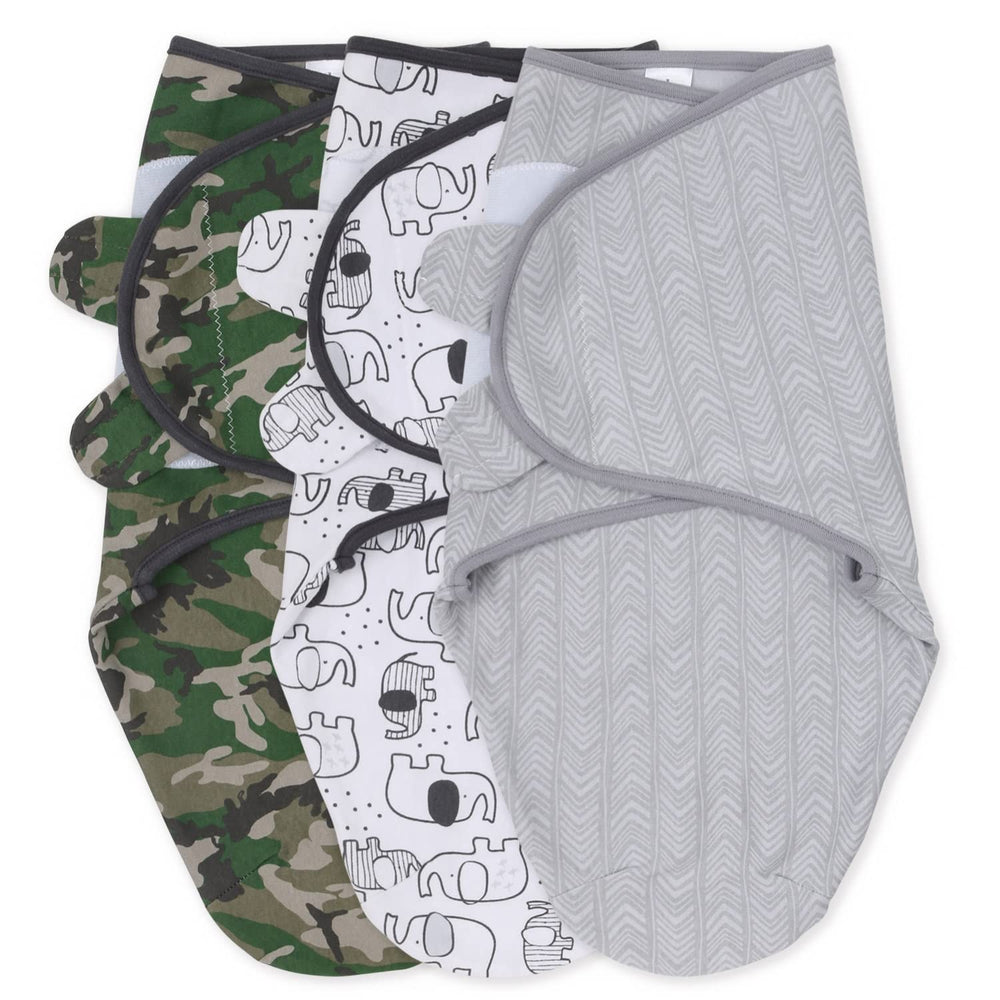 The Peanutshell swaddle set in olive camouflage offers a cozy, secure nap.