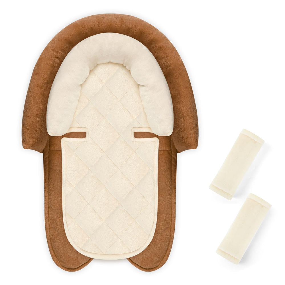 Pea Pod baby head and body support providing snug alignment for newborn rides.
