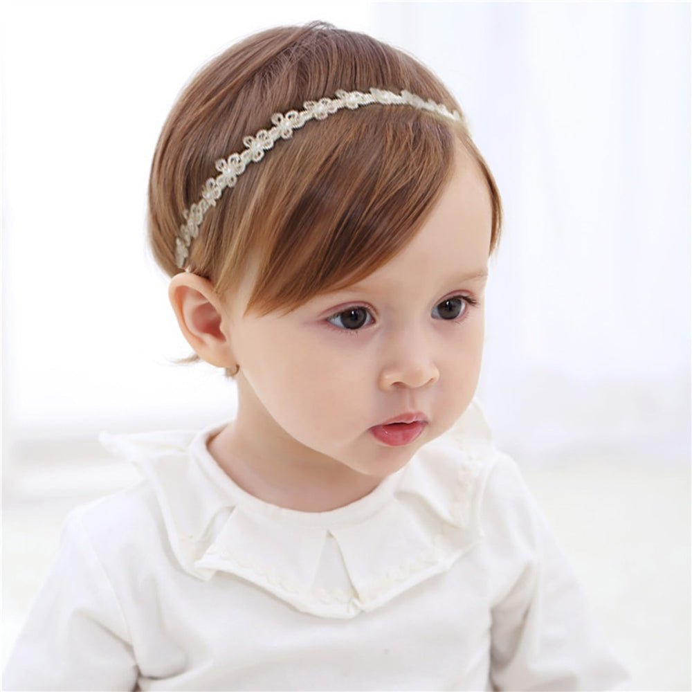Pejlnd baby headband in white lace pattern for gentle wear and photoshoots.