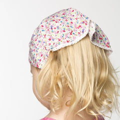 Peppercorn Kids bandana headband pink side view ideal for sunny days.