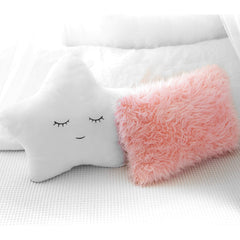 Perfectto Design pink furry pillow close-up emphasizes plush softness for cozy reading corners.