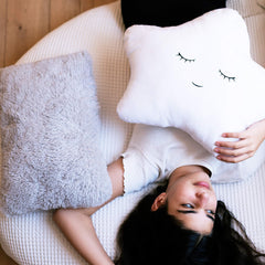 Perfectto Design white star pillow closeup showcases soft plush fibers ideal for cuddling.