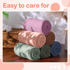 Peryiter hooded towel used as blanket or swaddle in playtime.