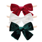 phnydreg velvet bow headband white front view highlights plush texture for newborn outfits.
