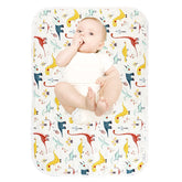 PHOEBUS BABY dinosaur changing pad top view shows soft cotton surface for gentle diaper changes.