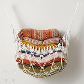 Photect wall-mounted blanket net shows space-saving storage