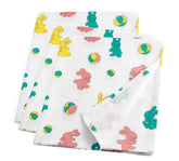Pill Thing Bunnyland swaddle blanket provides newborn comfort with breathable cotton blend.