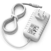 Pinkind 5V charger for Hello Baby HB66 neatly positioned on bedside table for reliable monitoring