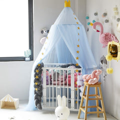Pinkrin bed canopy blue star decor creates a magical reading corner.