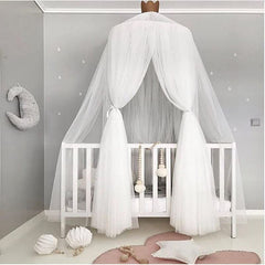 Pinkrin bed canopy over crib with star decor for a magical princess space.