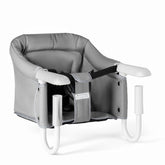 Pivvital hook-on high chair clip-on assembly demonstrates secure setup for meals.