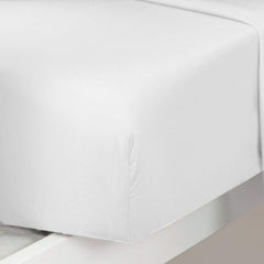 Plain Printed Linen fitted sheet demonstrates secure 8-inch pocket fit on standard toddler crib.