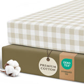 Pobibaby 2-pack crib sheets gingham khaki on a mattress for a snug fit.