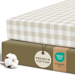 Pobibaby 2-pack crib sheets gingham khaki on a mattress for a snug fit.