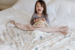 Pobibaby Wildflower blanket in stroller keeps baby warm during walks.