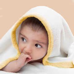 POLYTE hooded towel wrapped around baby after bath for cozy drying