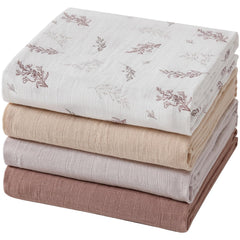 POMISO muslin swaddle blanket leaves pattern, ideal for swaddling and nursery decor.