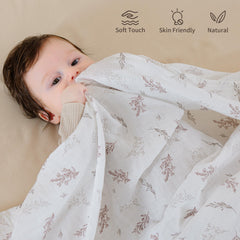 POMISO muslin swaddle blanket warm earth colors highlights cozy tones for calm feeding or naps.