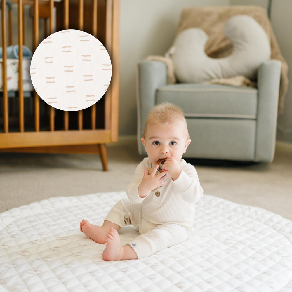 Poppyseed Play round mat with 43-inch diameter offering spacious tummy time area