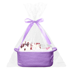 Poschnor baby gift basket in purple wrap, ready for gifting.