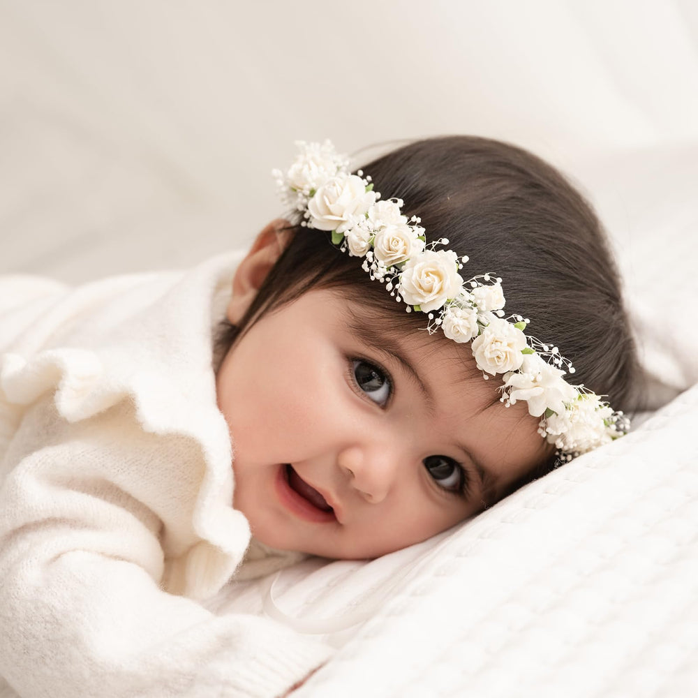 PoshMyra toddler flower crown closeup shows delicate baby’s-breath blooms for timeless photos.