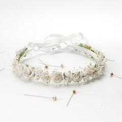 PoshMyra flower crown used as wedding photo prop with rustic charm.
