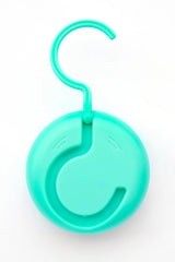 Potty Pause Aqua with hook stored on door for quick access