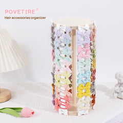 POVETIRE hair bow organizer rack neatly displays accessories on a dresser.