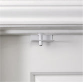 Predictable Solutions GlideLok top lock on interior door demonstrates child safety.