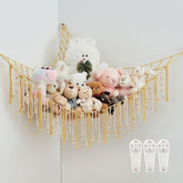 Pretty Jolly stuffed animal storage hammock with yellow tassels keeps plush toys organized in a kid's room.