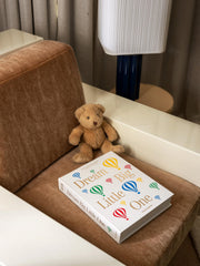 PrintWorks Dream Big Little One beige pages capture baby's first year milestones beautifully.