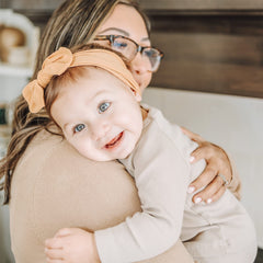 Prohouse nylon headbands demonstrating no compression marks on baby's forehead.