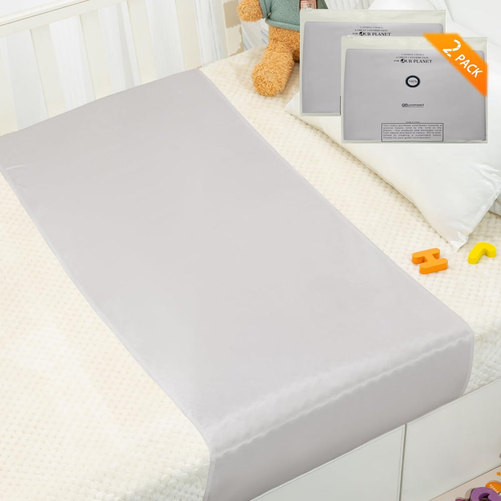 PROMEED silk bassinet sleeve closeup shows premium mulberry silk texture for gentle baby comfort.