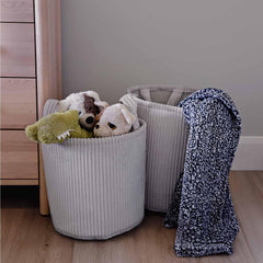 PUTSKA Blanket Basket round side view highlights easy-carry handles for moving between rooms
