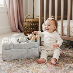 Putska diaper caddy helps stylishly organize nursery with 8 pockets.