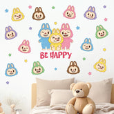 Pycat Be Happy Macaron Monster decals brighten a kid's bedroom with playful decor.