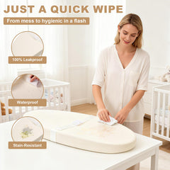 Qalvyn pad shows non-slip base and safety strap for secure diaper changes.